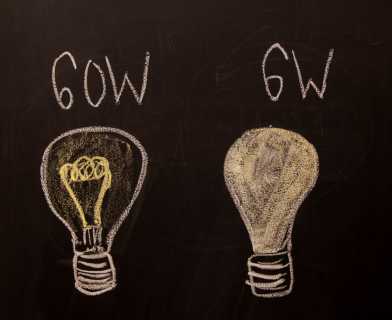 What is the difference between using a cnventional lightbulb with 60 Watt or an energy efficient one with  6 Watt?
